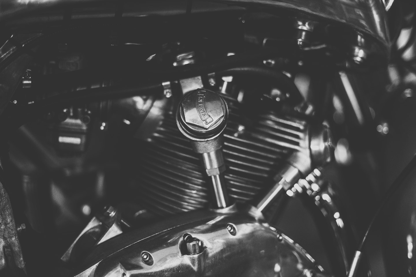 Polished chrome motorcycle engine with visible cooling fins.